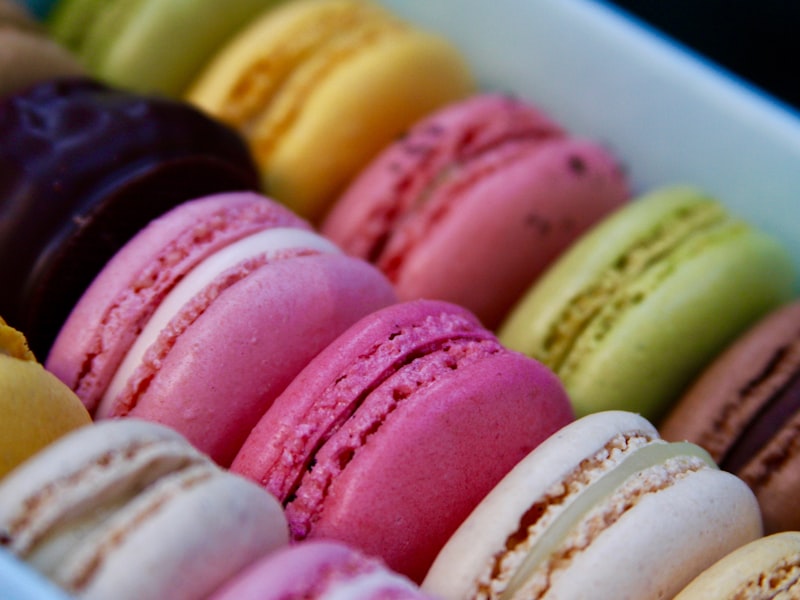 Colorful French macarons arranged in rows